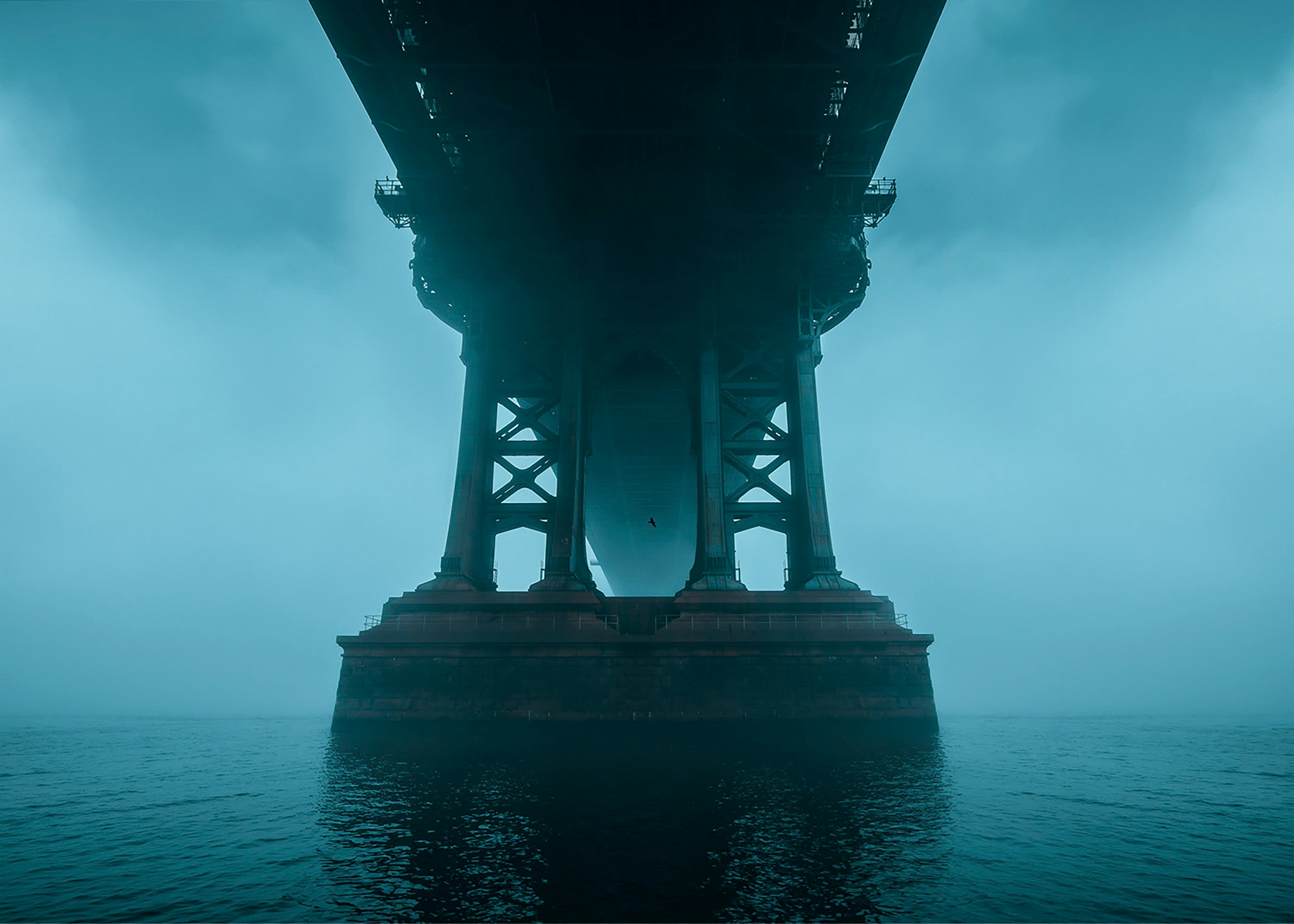 brown concrete tower on body of water